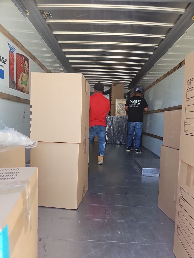 Wrapped furniture loaded for storage while a Ventura County home is repaired