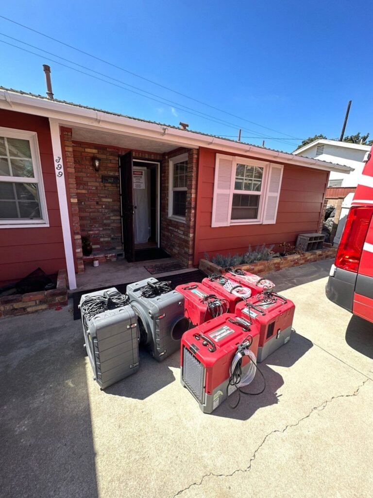 Drying equipment unloaded on the driveway of a single-storey house in Ventura County